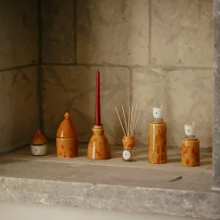 Candeliere in ceramica caramello con 4 candele profumate