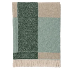 Coperta verde con frange e motivi intrecciati